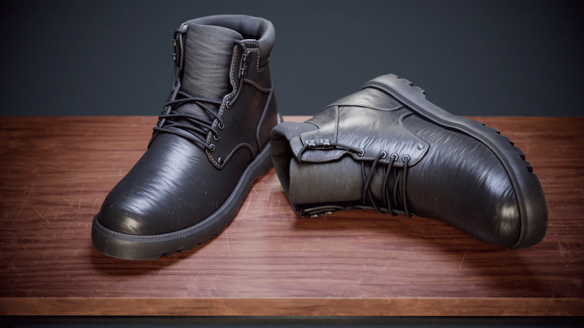 The same pair from a lower angle, the upright boot showing its laced front.