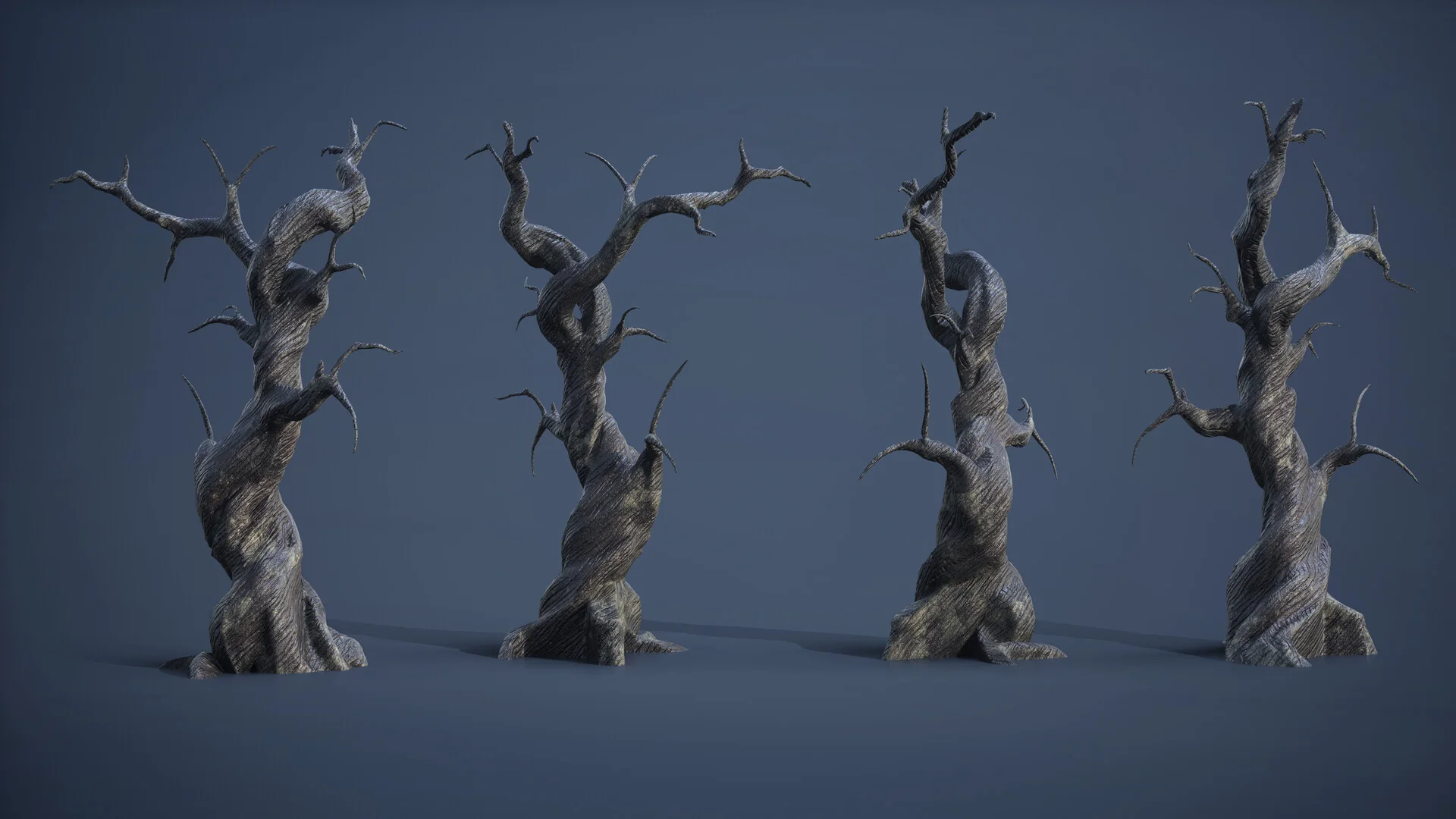 Four variations of the dead tree asset lined up against a dark backdrop.