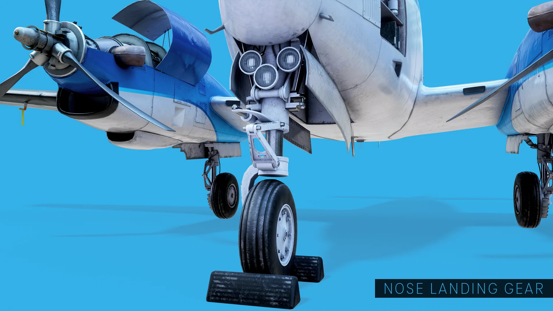 Nose landing gear extended, with the taxi and landing light cluster in the wheel well above it.