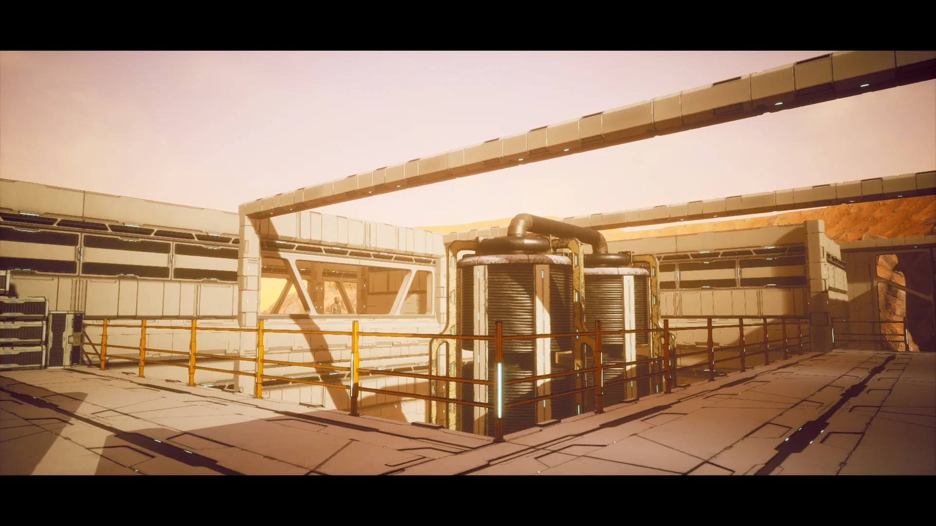 Open courtyard of the outpost with railings, overhead gantries and the tank cluster at its centre.